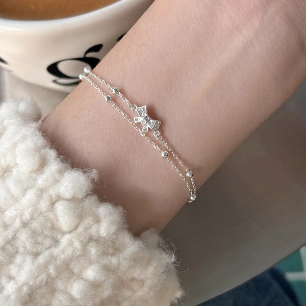 Sweet Bow Tie Bracelet for Women in 925 Sterling Silver with 18K Real Gold Electroplated and Zircon Inlay