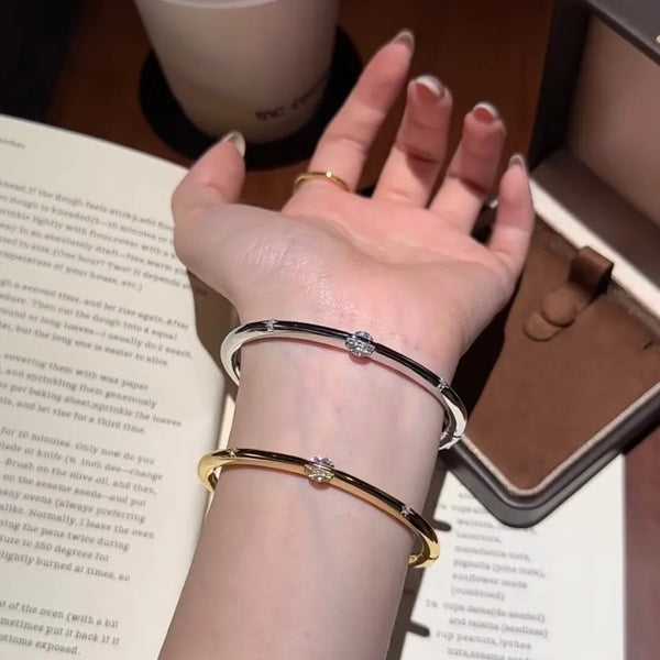 Irregular Asymmetrical Bangle in Copper with Electroplated Gold Plating and Zircon Inlay
